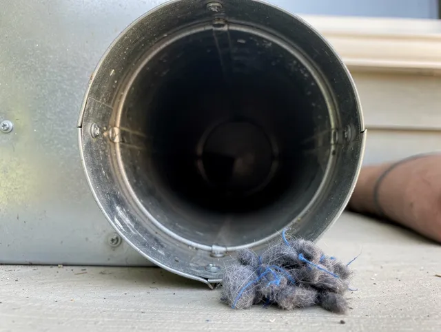 East Cleveland Dryer Vent Cleaning technician using specialized equipment to clear severe dryer vent blockage in East Cleveland